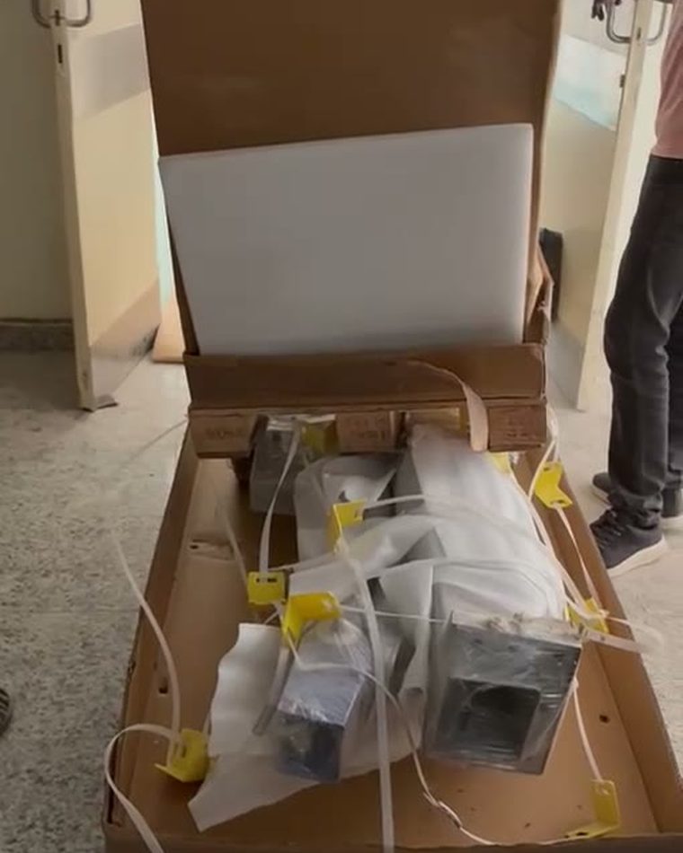 A factory-sealed equipment crate opened and inspected on delivery