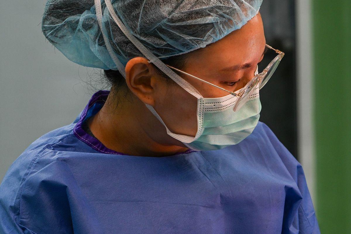 A surgical team at work in a fully equipped theatre